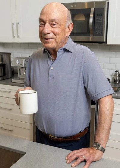 a man standing at a kitche counter